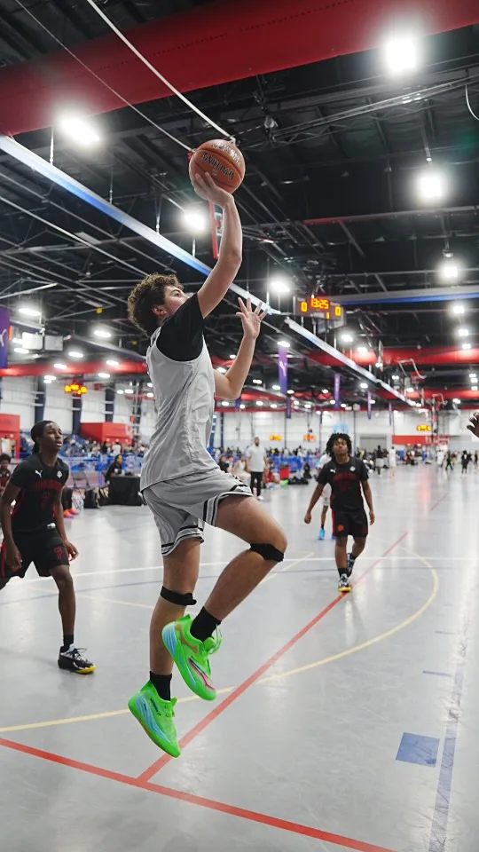 Driven Athletes player rising for a layup during PUMA NXTPRO Circuit tournament play